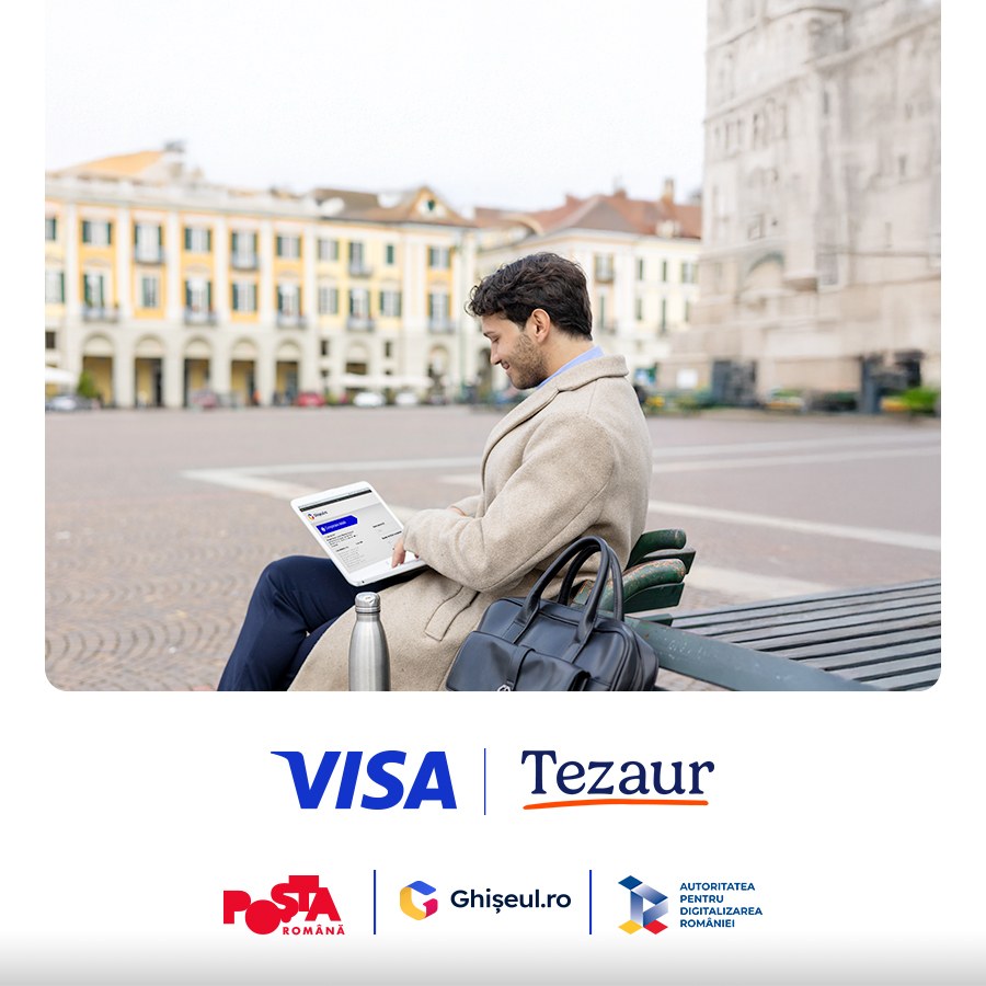 man sitting on park bench with laptop